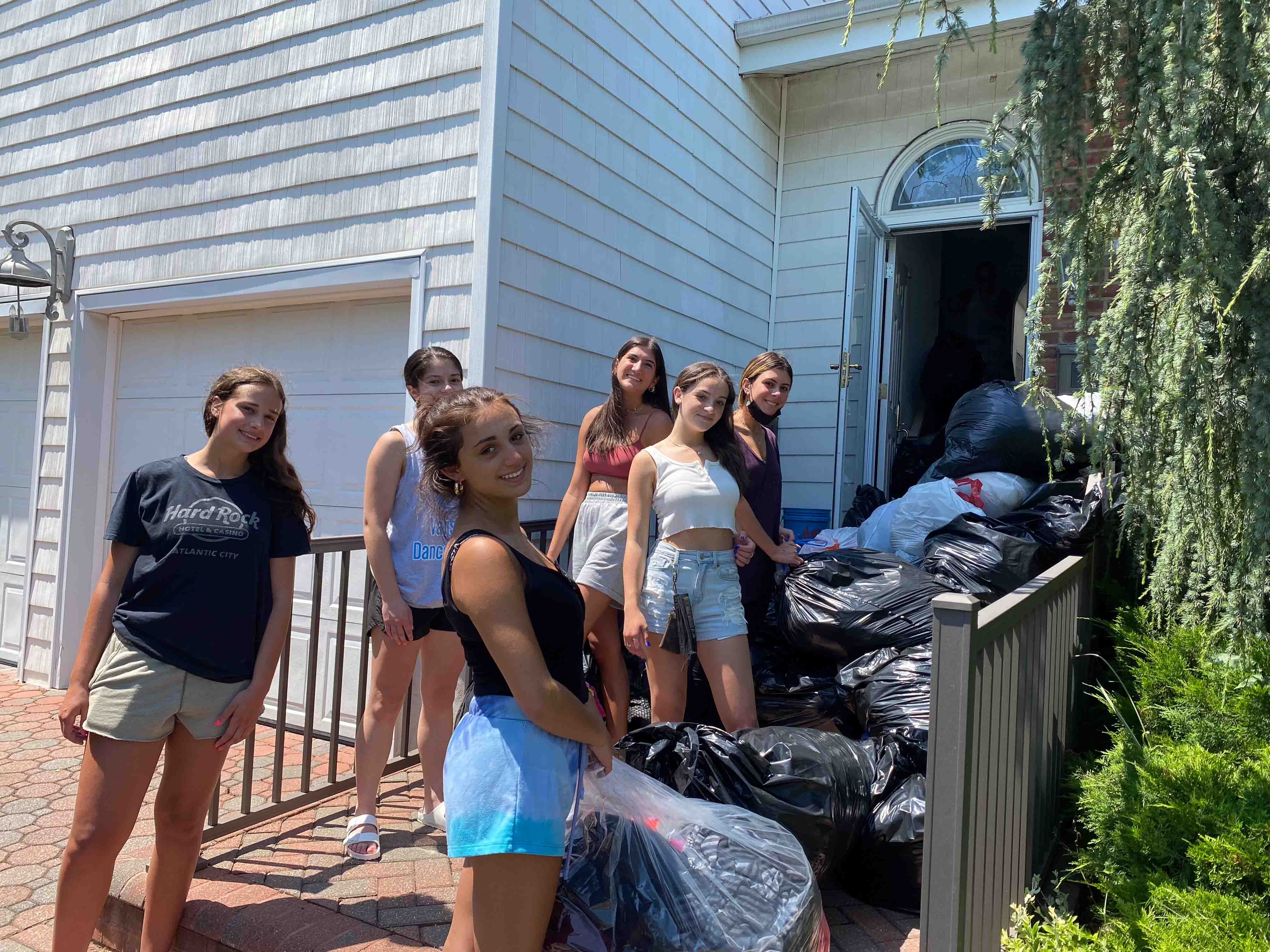 Volunteers sorting clothing for donation