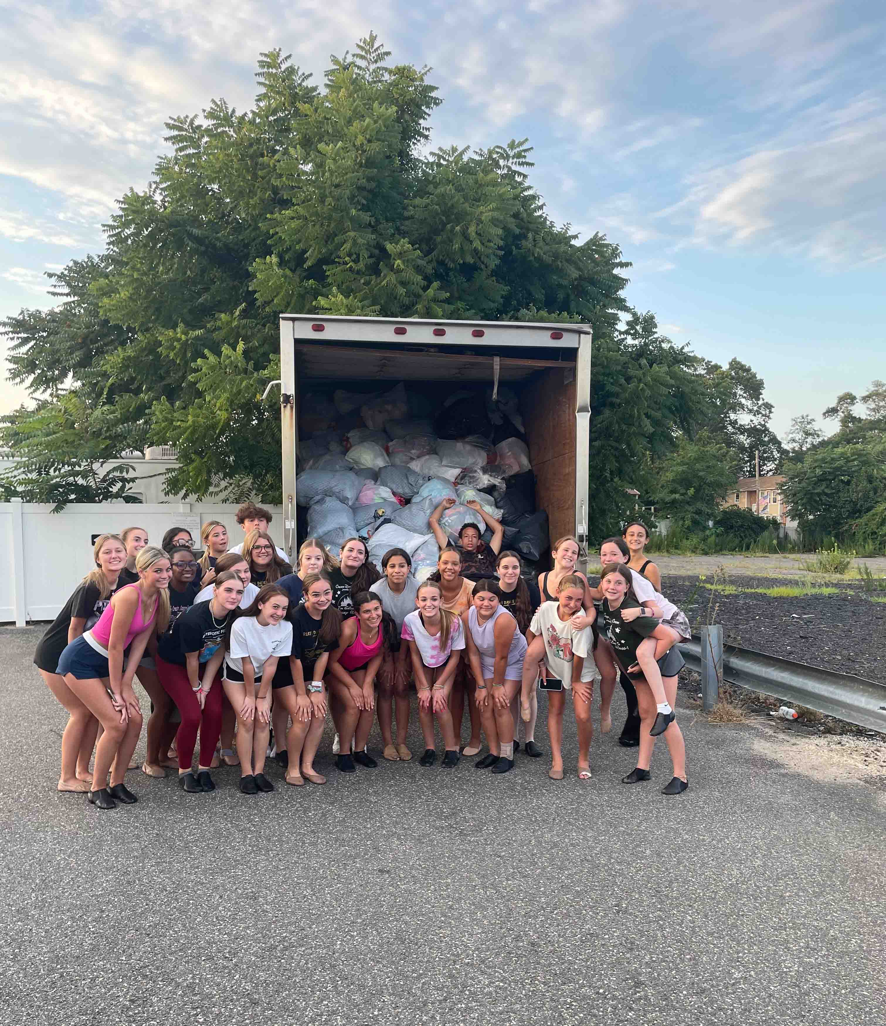 Families donating clothes for a fundraiser