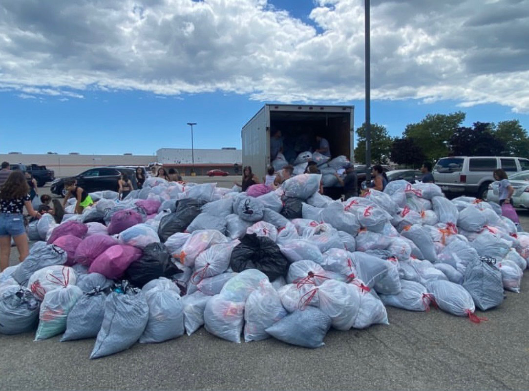 Student volunteers collecting clothing