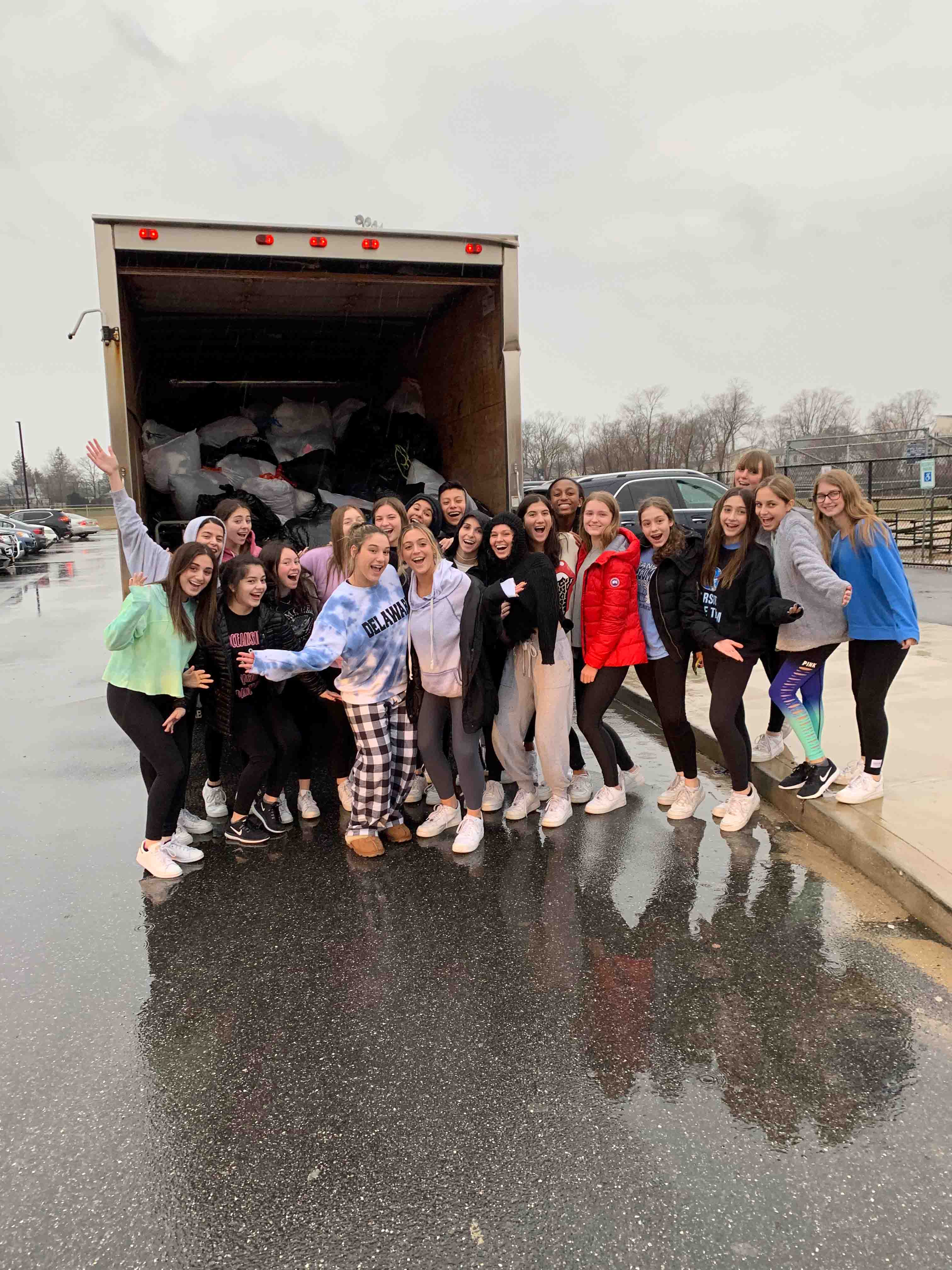 Team members loading donation bags into truck