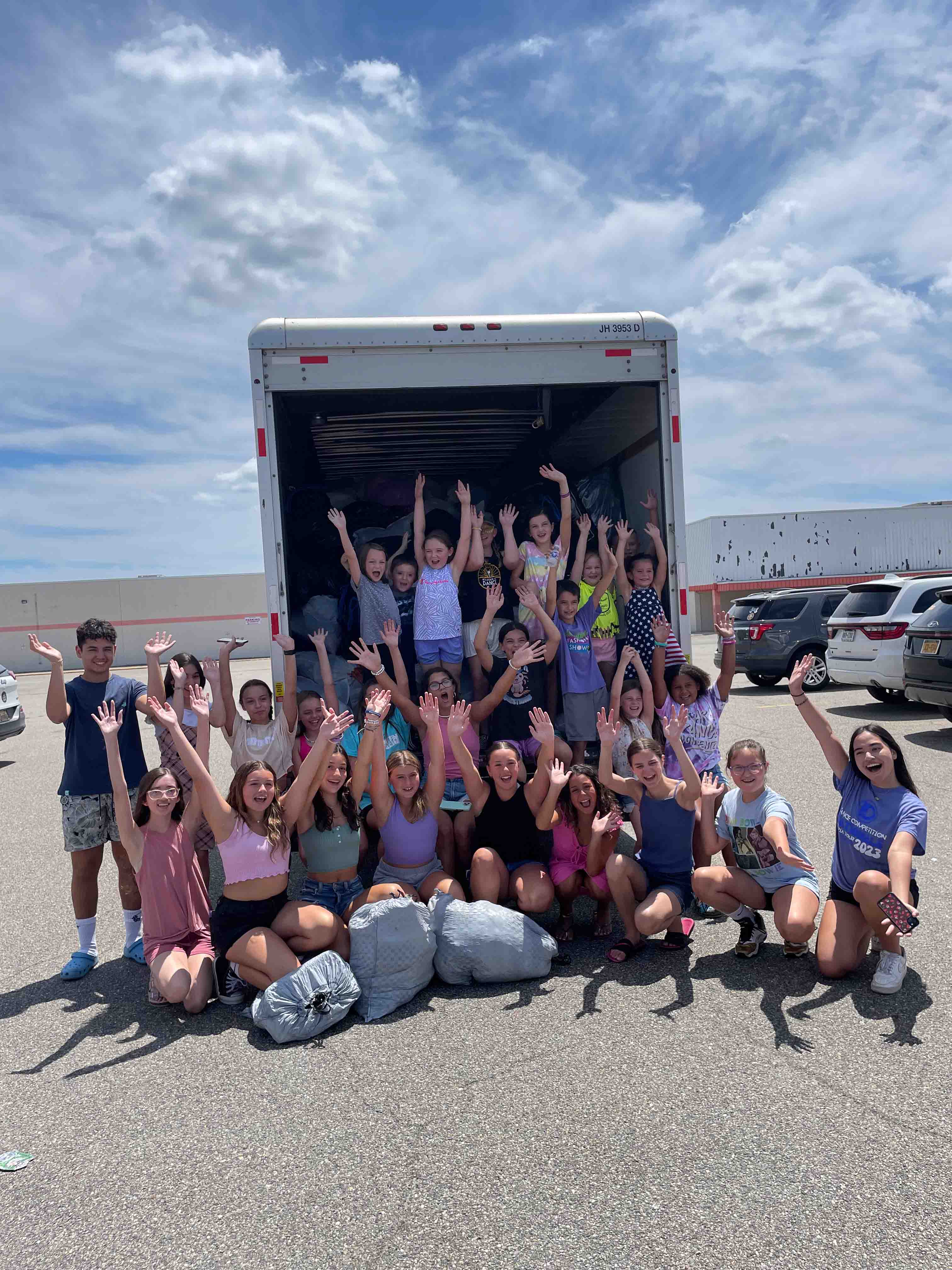 Smiling volunteers at drop-off site