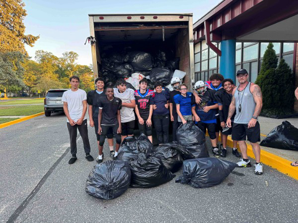 Go Green Clothing Drive crew sorting donated clothes on-site