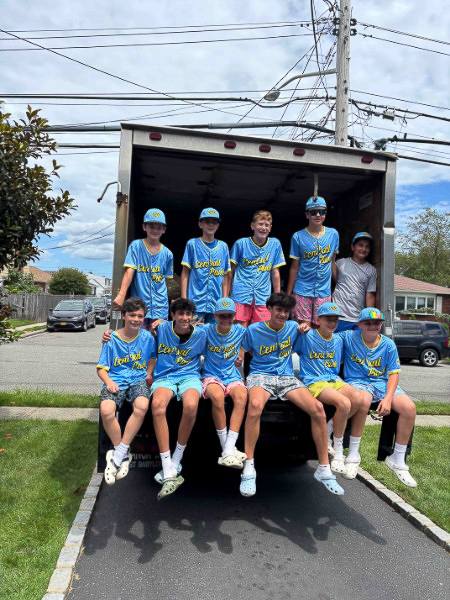 Community members donating clothes to support local youth programs through Go Green Clothing Drive