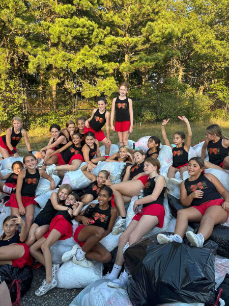 Community members dropping off clothing donations at a local fundraiser